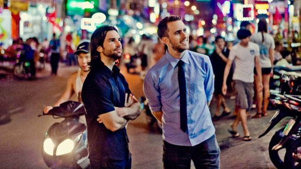 Minaal co-founders Doug and Jimmy standing in a crowded street in Vietnam